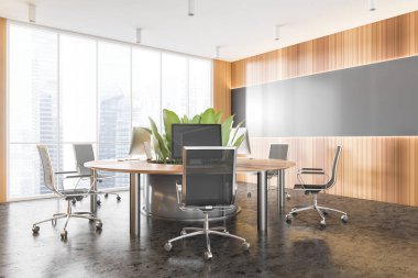 Gri ve ahşap duvarları, beton zemini ve yuvarlak bilgisayar masası olan şık bir açık uzay ofisinin köşesi. 3d oluşturma