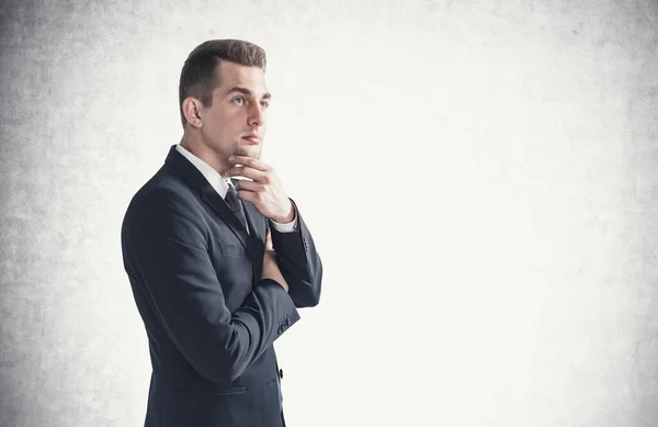 Side Portrait Pensive Young European Businessman Standing Concrete Wall Concept — Stock Photo, Image