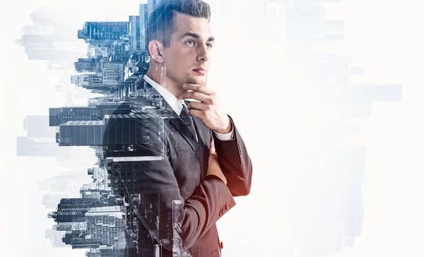 Side portrait of pensive young European businessman standing in blurry city. Concept of leadership and planning. Mock up