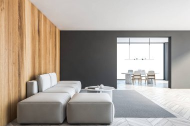 Gri ahşap oturma odasında, beyaz kanepesi ve gri halıda kahve masası olan siyah fotokopi odası. Arka planda yemek odası, büyük pencereli, gri ahşap zemin 3D, kimseyi göstermiyor.