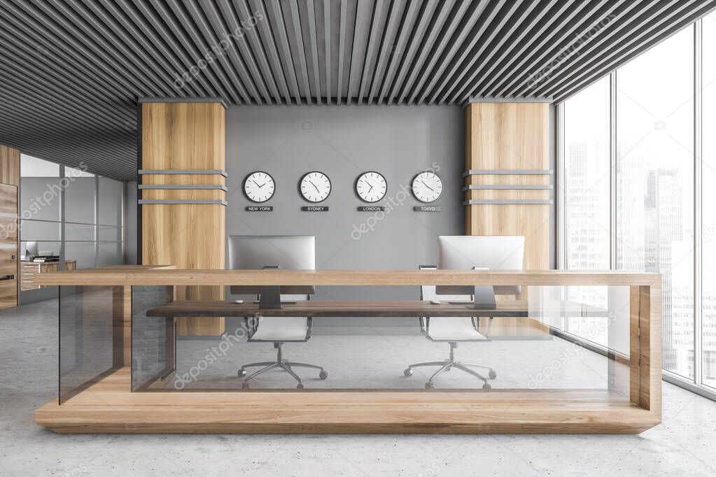 Interior of modern office with gray and wooden walls, concrete floor and reception desk with clocks above it. 3d rendering