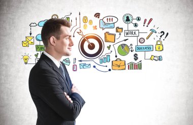 Beton duvarın yanında duran kendine güvenen genç işadamının portresi üzerine iş amaçlı bir çizim yapılmış.