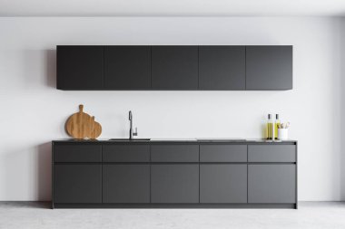 Beyaz duvarları, beton zemini ve lavabo ve fırında yapılmış gri dolapları olan modern mutfağın içi. 3d oluşturma