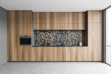 Gri duvarları, beton zemini ve lavabo ve fırında yapılmış ahşap dolapları olan şık bir mutfak. 3d oluşturma