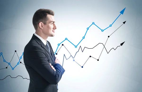 Side View Confident Young Businessman Standing Gray Wall Growing Graphs — Stock Photo, Image