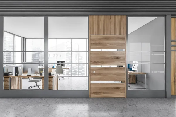 Interior of modern office hall with gray and wooden walls, concrete floor and open space office. 3d rendering
