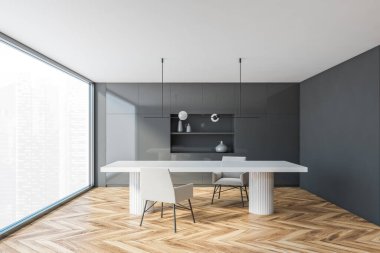 Gri duvarları, ahşap zemini ve beyaz yemek masası olan panoramik bir mutfağın içi. 3d oluşturma