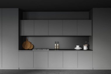 Koyu gri duvarları, beton zemini ve gri dolapları olan şık bir mutfak. 3d oluşturma