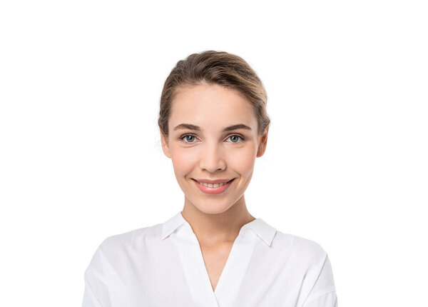 Isolated portrait of smiling young European businesswoman looking at you. Concept of positive emotions
