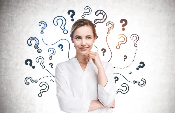 Cheerful Young Businesswoman Standing Concrete Wall Question Marks Drawn — Stock Photo, Image