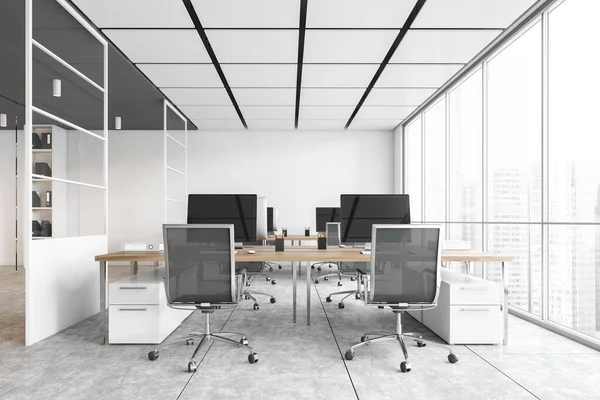 White office room with armchairs and computers on the wooden tables near windows. White office room with modern minimalist furniture on marble floor, 3D rendering no people