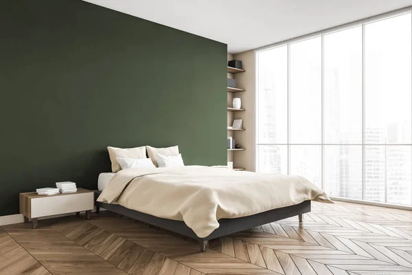 Green and beige bedroom, bed with pillows and linens, side view, coffee table with books. Green wall and parquet floor, bookshelf near window with city view, 3D rendering no people