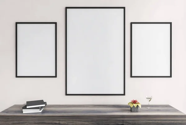 Three mockup canvas, frames on white wall above wooden deck with books and cocktail. Black frames for photos in living room, 3D rendering no people