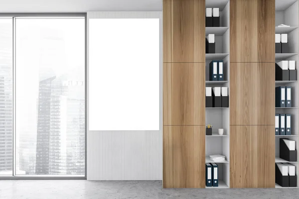 Mockup canvas in office room with wooden shelves, folders and papers near big window with city view on skyscrapers. Wooden and grey office room, 3D rendering no people