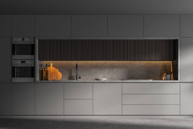 Ahşap ve gri dolaplar gri duvarları ve beton zemini olan modern mutfakta duruyor. 3d oluşturma