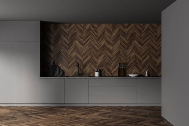 Gri ve ahşap duvarları, ahşap zemini ve lavabo ve fırından yapılmış gri dolapları olan şık bir mutfak. 3d oluşturma