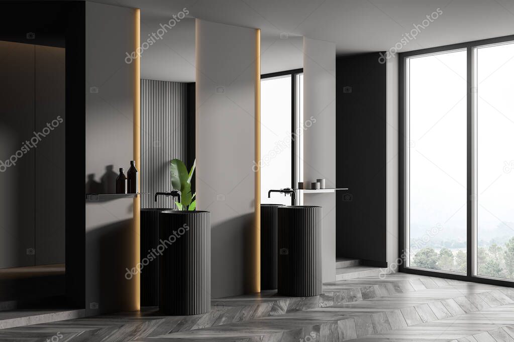 Corner of a comfortable bathroom with gray and wooden walls, wooden floor, two round sinks and a window with a blurry tropical view. 3d rendering