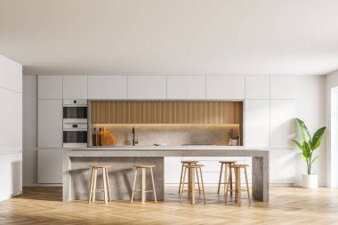 Beyaz duvarları, ahşap zemini, bar tezgahı ve iki fırını olan modern mutfağın içi. 3d oluşturma