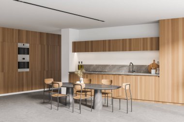 Modern mutfağın köşesinde beyaz duvarlar, beton zemin, yemek masası ve dolaplar 3D.