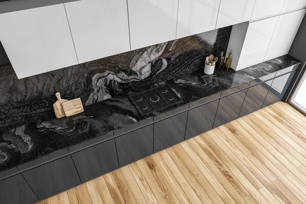 Top view of black and white kitchen set with appliances and stove, parquet floor. Modern minimalist kitchen set from above with marble decoration, 3D rendering no people