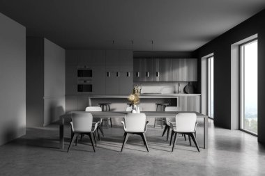 Gri duvarları, beton zemini, gri ve ahşap tezgahları olan modern mutfak. Yanında sandalyeler olan uzun bir masa. 3d oluşturma