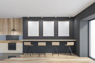 Gri duvarda üç beyaz afiş, ahşap tezgah ve fırında yapılmış bir mutfak. 3d hazırlama taklit alanı.