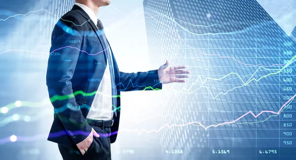 Businessman in formal suit holds out his hand for a handshake. Stock market concept. Double exposure of financial graph hologram. low angle skyscraper