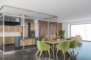 Mutfağı ve yeşil sandalyeli yemek masası olan büyük bir yemek odası. Mobilyaları ve mutfağı olan açık bir uzay odası. Siyah zemin üzerinde cam kapılar var. 3 boyutlu.