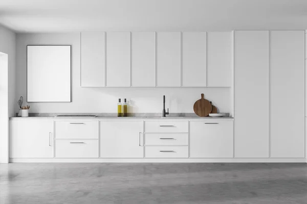 Modern kitchen interior with white walls, modern countertops with a built in sink and a cooker. White poster on wall. 3d rendering mock up