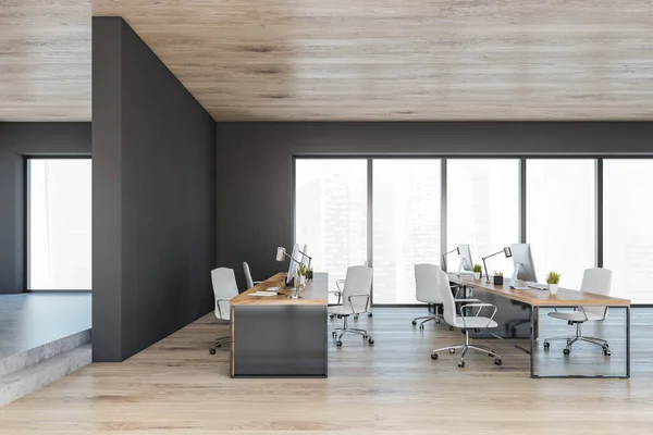 Wooden black office room with minimalist furniture, row of tables with computers, side view. Manager consulting room with modern furniture and small plants, 3D rendering no people