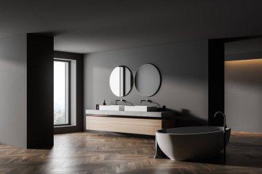 Odanın ortasında çift lavabolu ve beyaz küvetli modern banyo. Kahverengi ahşap parke zeminli eko minimalist tarzda. Ve iki yuvarlak ayna. İnsan yok. 3B Hazırlama