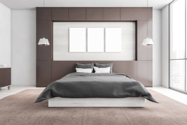 Yatağın üzerinde gri çarşaflar, yastıklar, kahverengi halı olan üç tane poster. Beyaz ve bej yatak odası şehir manzaralı, 3 boyutlu, kimseyi göstermiyor.