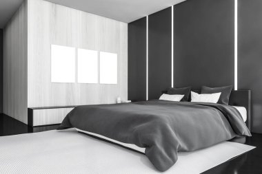 Ahşap yatak odasının içinde boş tuval posterler ve siyah zeminli mobilyalar. Duvarda arka ışık ve çekmecede büyük afiş var. 3D, kimseyi göstermiyor.