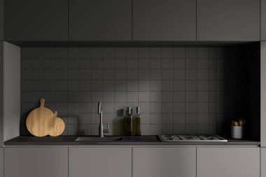 Koyu gri modern mutfak iç dekorasyonunun mutfak malzemeleriyle ön yüzü. Beton zemin. Duvarda siyah cepheler ve seramik fayanslar var. 3d oluşturma.