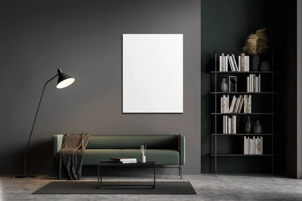 Dark grey modern living room interior furnished by green sofa, coffee table, bookshelf and one empty white posters on black wall. Concrete floor. Home library concept. 3D rendering