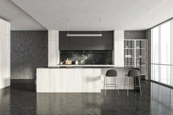 Dark kitchen set with white wooden table and two bar chairs, black concrete floor and window. Kitchen interior with minimalist furniture, front view, kitchenware and cupboard, 3D rendering