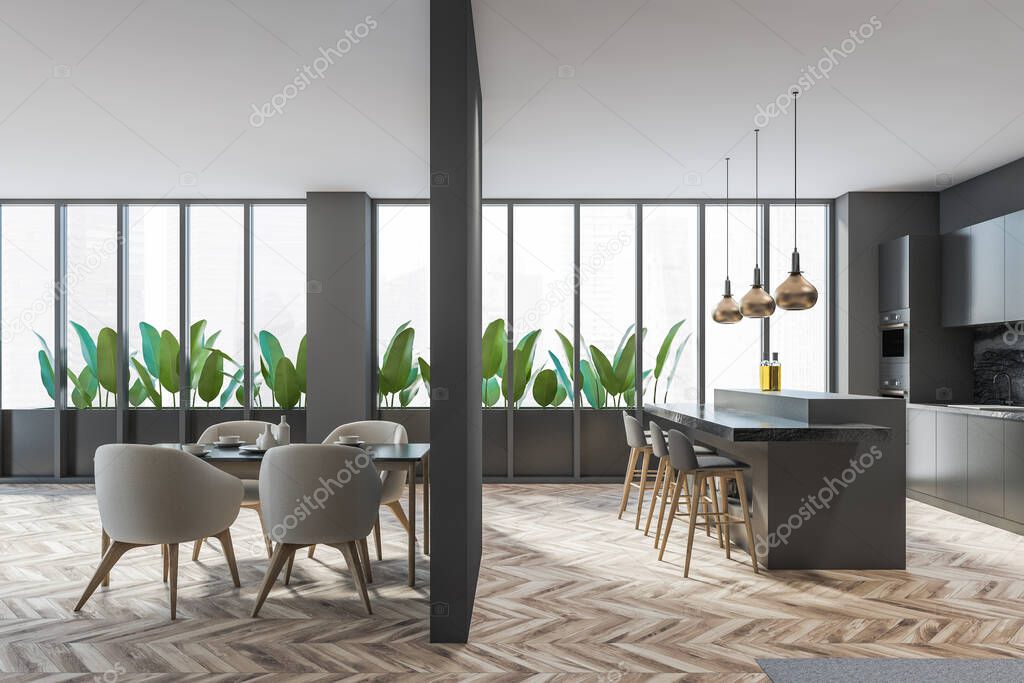 Dark extensive kitchen and dining room interior with large panoramic window, bar counter, four cosy barstool, armchair and partition. Oak wooden parquet floor. Contemporary design apartment