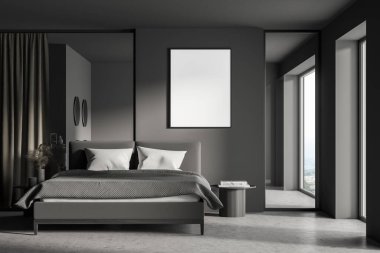 Karanlık duvarında boş beyaz bir poster, rahat gri yatak, kırsal manzaralı panoramik pencere, beton zemin. Uyku odasının minimalist modern tasarımı