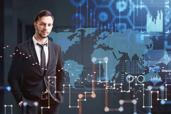 Portrait of handsome businessman in black suit looking at camera, hands in pockets. Stock market changes candlesticks, data information icons and rising graph over worldwide digital map.
