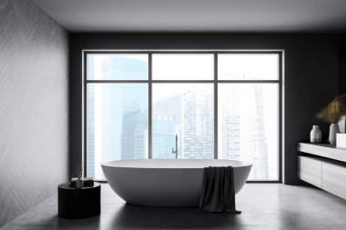Beyaz küvet ve havlularla dolu gri banyo, dekorasyonlu çekmece, beton zemin. Şehir manzaralı modern iç mekan ve pencere, 3D, kimseyi göstermiyor