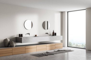 Beton lavaboları, yuvarlak aynaları, sanat dekorasyonu ve beton zemini olan hafif bir banyo. Modern stil banyo iç dekorasyonu, kırsal kesimde penceresi olan, 3 boyutlu.