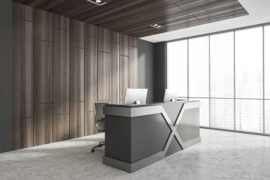 Üzerinde iki bilgisayar bulunan gri ve ahşap duvarlar, beton zemin ve resepsiyon tezgahı olan minimalist İskandinav tarzı ofis köşesi. Bulanık şehir manzaralı bir pencere. 3d oluşturma