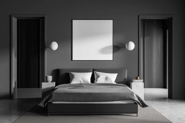 Dark bedroom interior with bed and grey carpet, concrete floor and coffee tables with books and lamps. Mockup copy space frame in sleeping room with stylish furniture, 3D rendering