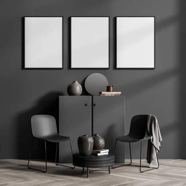 Relaxing room interior with grey commode drawer with books and vase, two armchair and coffee table on parquet floor. Three blank posters in row on grey wall, 3D rendering