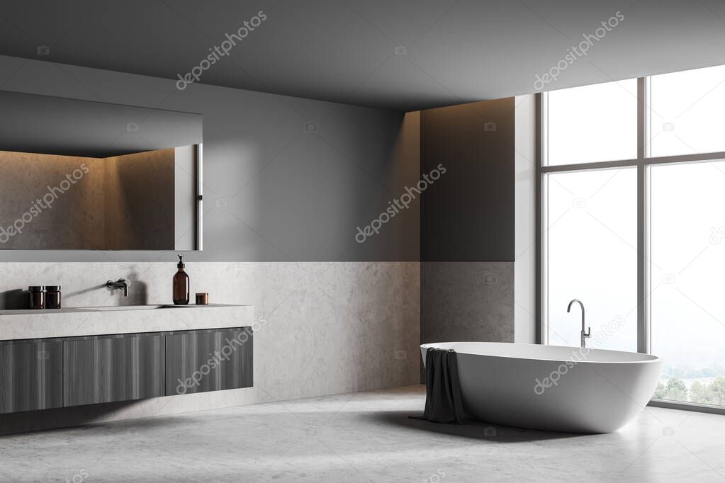 Dark bathroom interior with white bathtub and sink with bath accessories, side view. Minimalist room with modern furniture and view on countryside, 3D rendering no people