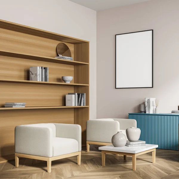 Corner of the living room interior with poster on beige wall. Wide wooden bookshelf, blue sideboard with fluted surface, two armchairs and coffee table. Parquet floor. Mock up. 3d rendering