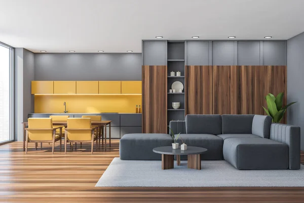 带客厅的工作室的全景内部 灰色沙发 有咖啡桌 较低的抽屉 地毯和墙壁 半黄厨房木制桌子 箱橱和地板 3D渲染 — 图库照片
