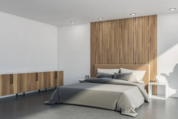 Interior with bed, sideboard, white walls, side tables and ceiling, wooden details, indoor plant, grey concrete flooring and panoramic view. 3d rendering