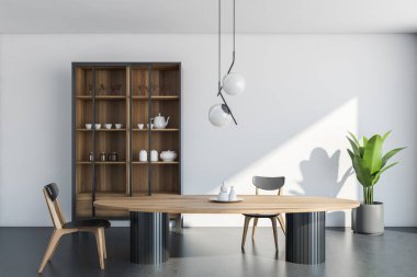 İçi ahşap kapaklı oval yemek masası, iki sandalye, çanak çömlekli ve sürgülü cam kapılı dolap, beyaz duvar, orijinal ışık, kapalı bitki ve koyu beton zemin. 3d oluşturma