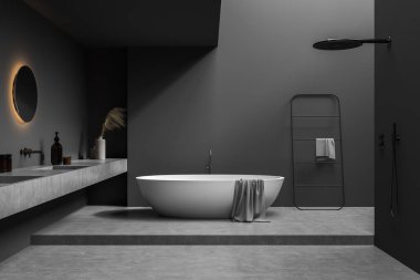 Oval küvetin içi koyu gri banyo, iki leğen, açık duş, beton döşeme ve yanan yuvarlak ayna sihirli bir his yaratıyor. Modern ev tasarımı kavramı. 3d oluşturma